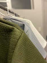 Load image into Gallery viewer, A picture of the SWÄV emoji T-Shirts lined up🤟🏾